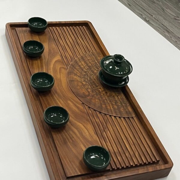 TRAVINA travel tea tray with Dong Son drum carving holding a teapot and cups